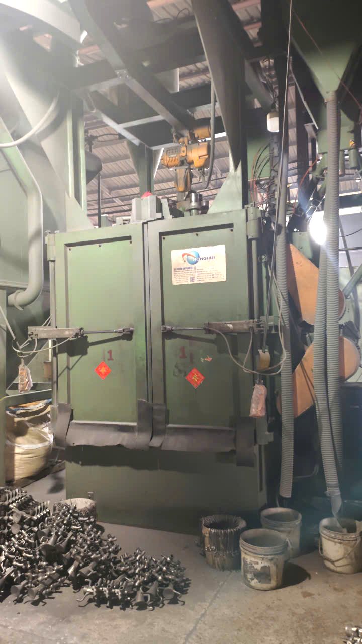 Shot blasting machine with castings ready for cleaning